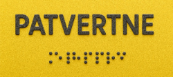 Dzeltena zīme braila rakstā, uz kuras uzraksts "patvertne"