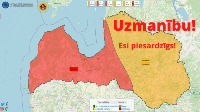 Latvijas karte, kuras rietumdaļa iekrāsota sarkanā krāsā, bet austrumu daļa - oranžā. Klāt pievienots teksts: Uzmanību! Esi piesardzīgs!